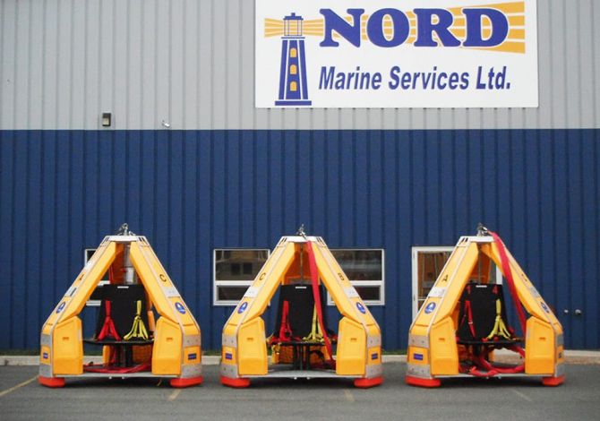 Three Reflex Marine FROG devices outside a Nord Marine Services Limited warehouse.
