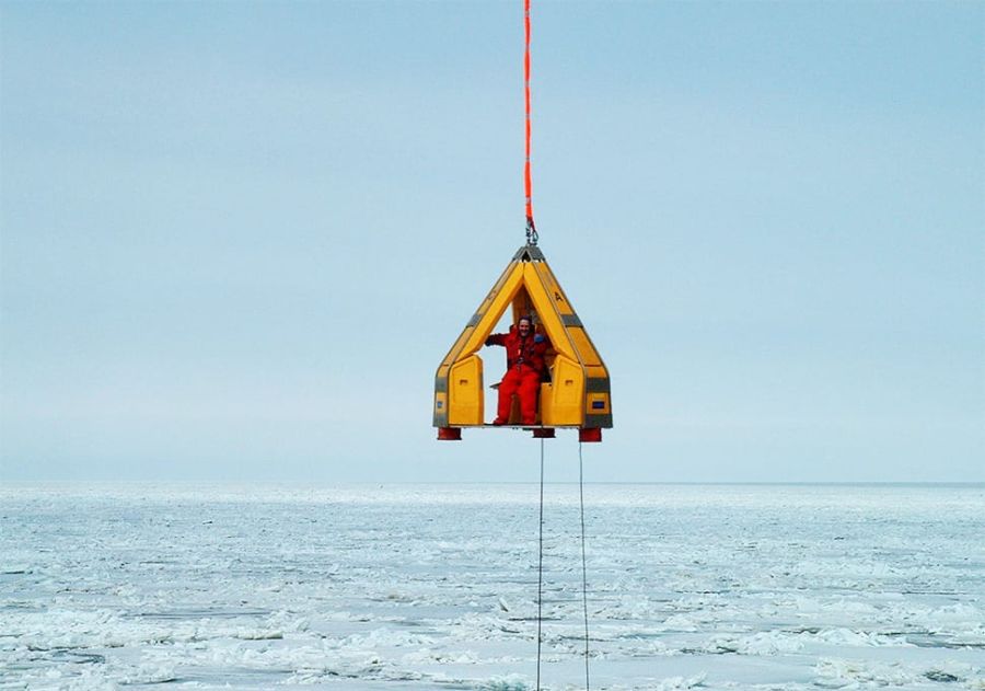 Reflex Marine FROG 3 suspended over the sea: an arctic crane transfer.