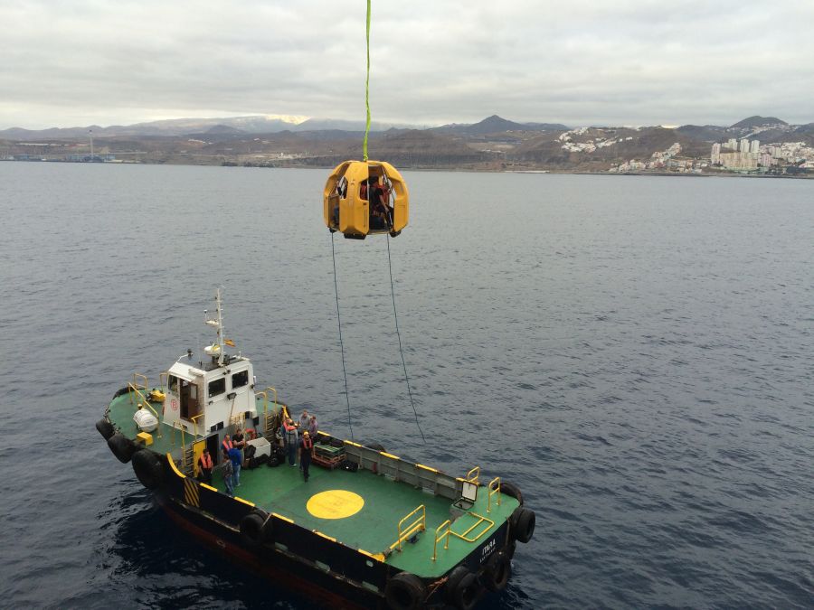 Reflex Marine FROG-XT4 being lifted by crane from a ship.