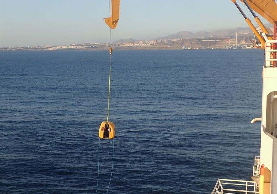 Stena Drilling personnel are transferred via crane from an oil rig in a Reflex Marine FROG XT.