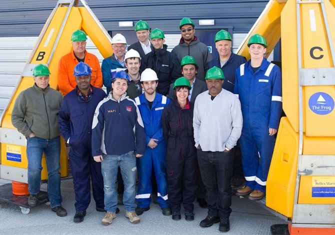 The Reflex Marine support, training and maintenance team pose with two FROG devices.